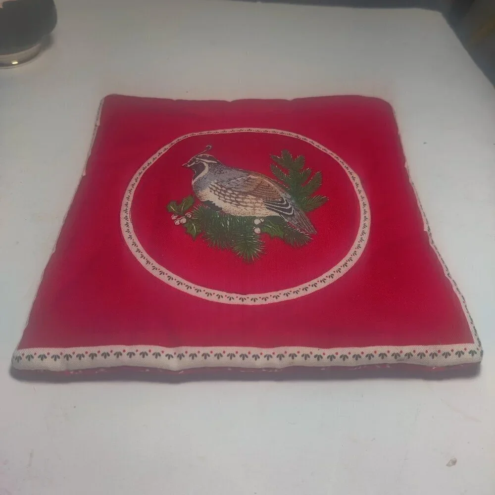Hotpad detailed with a lifelike Quail on a red background. Quaint and beautiful.